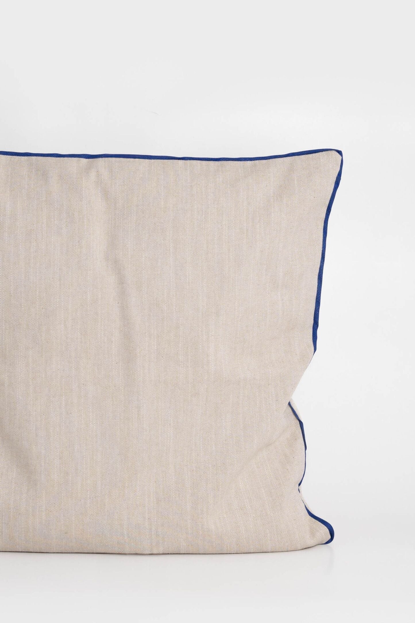 Cotton cushion cover with elegant blue border detail, made from soft, durable fabric. Ideal for adding a minimalist and timeless design to your home decor.Made in Portugal.