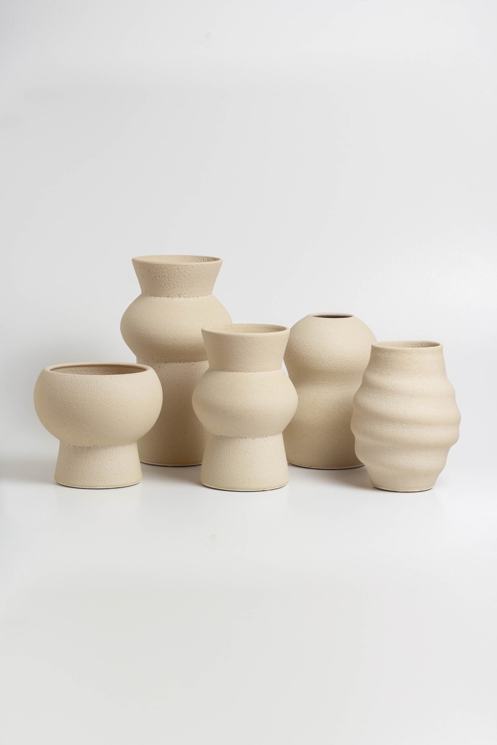 decorative vases in cream, minimalist design inspired by the beauty of volcanic textures. It's durable, sustainable and handmade in Portugal.