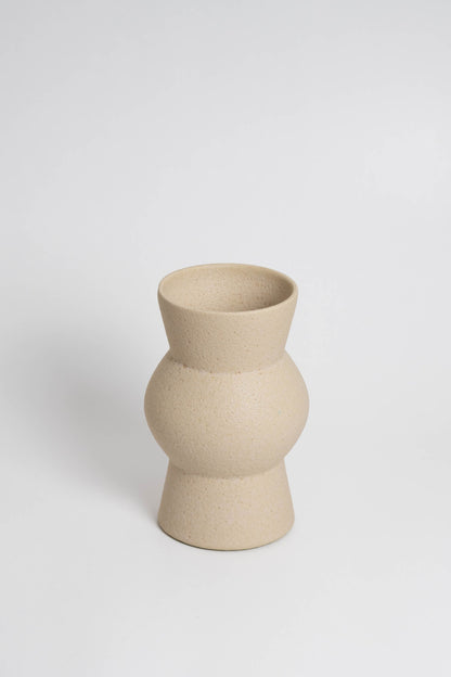 Melas in cream, ceramic vase with a textured, earthy surface, handmade in Portugal. Perfect for displaying flowers or as a unique decorative vase in modern interiors.