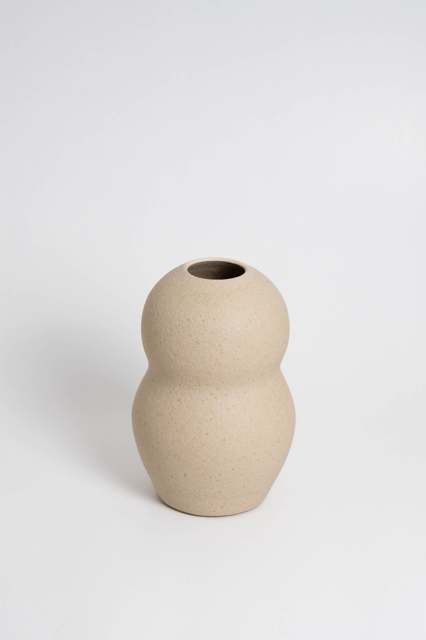 Palus in cream, ceramic vase with a textured, earthy surface, handmade in Portugal. Perfect for displaying flowers or as a unique decorative vase in modern interiors.