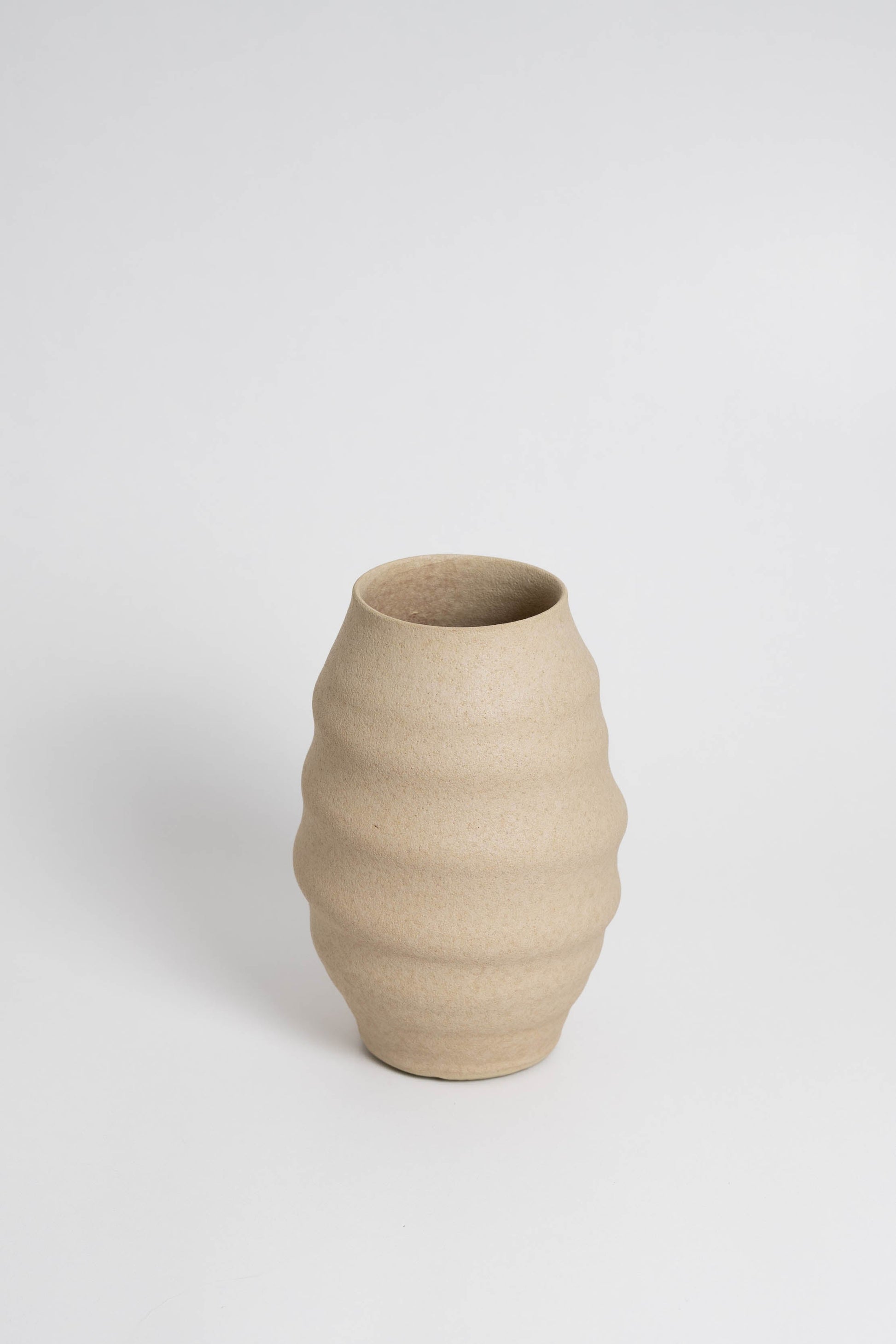 Aonia in cream, decorative vase, minimalist design inspired by the beauty of volcanic textures. It's durable, sustainable and handmade in Portugal.