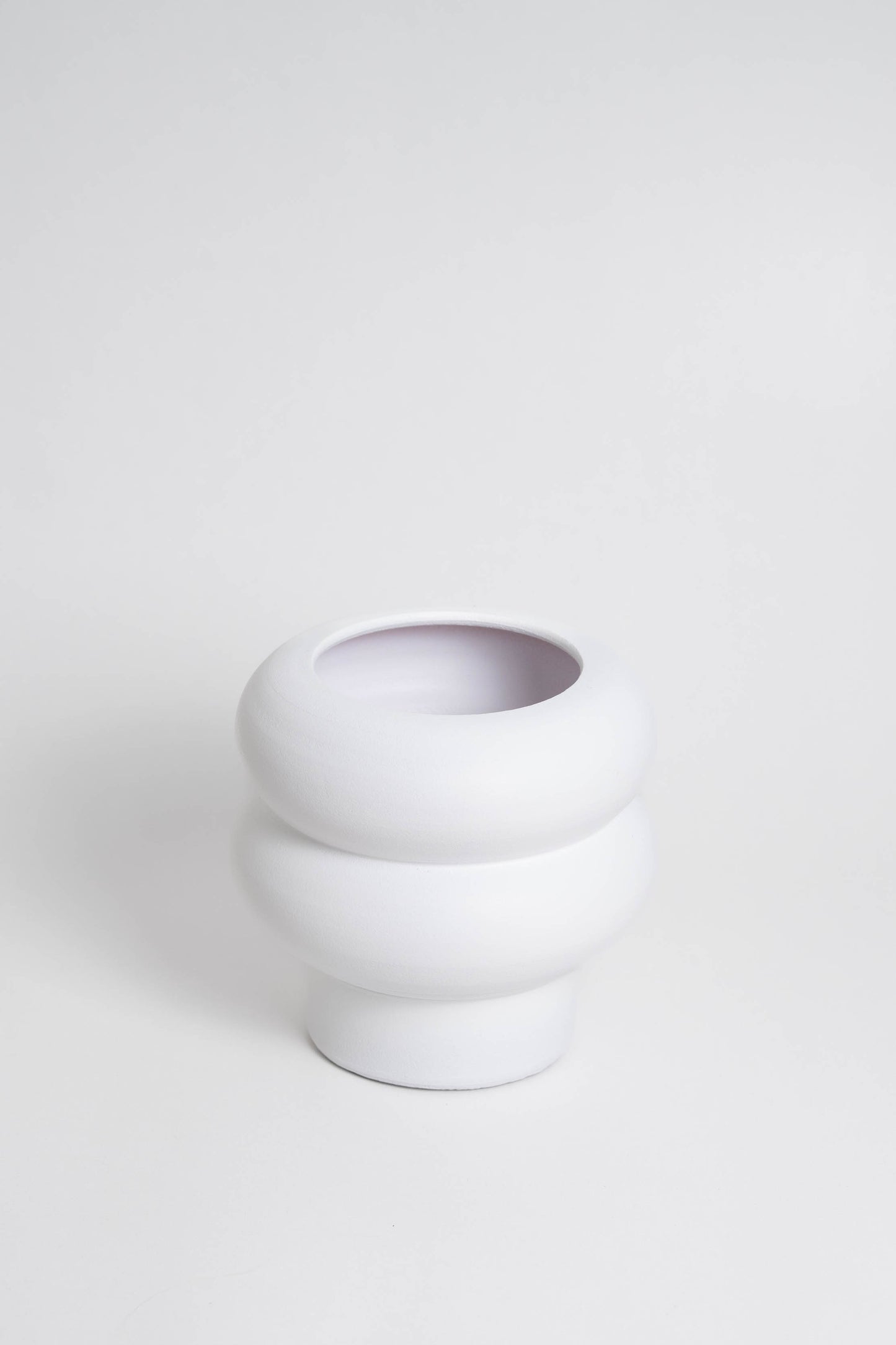 white ceramic with a minimalist design, handmade in Portugal. Ideal for displaying flowers or as a standalone decorative vase.