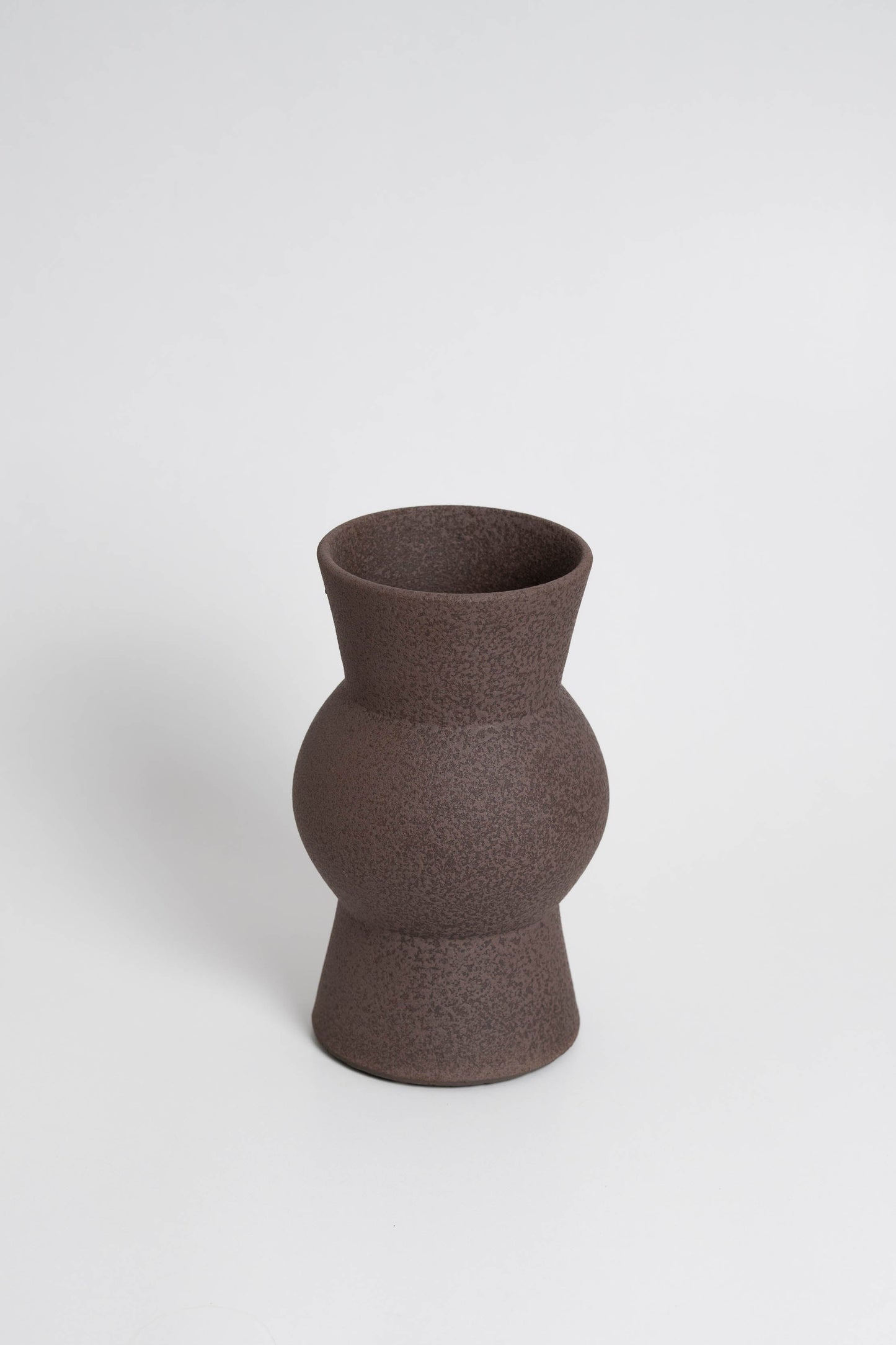 Melas in brown, ceramic vase with a textured, earthy surface, handmade in Portugal. Perfect for displaying flowers or as a unique decorative vase in modern interiors.