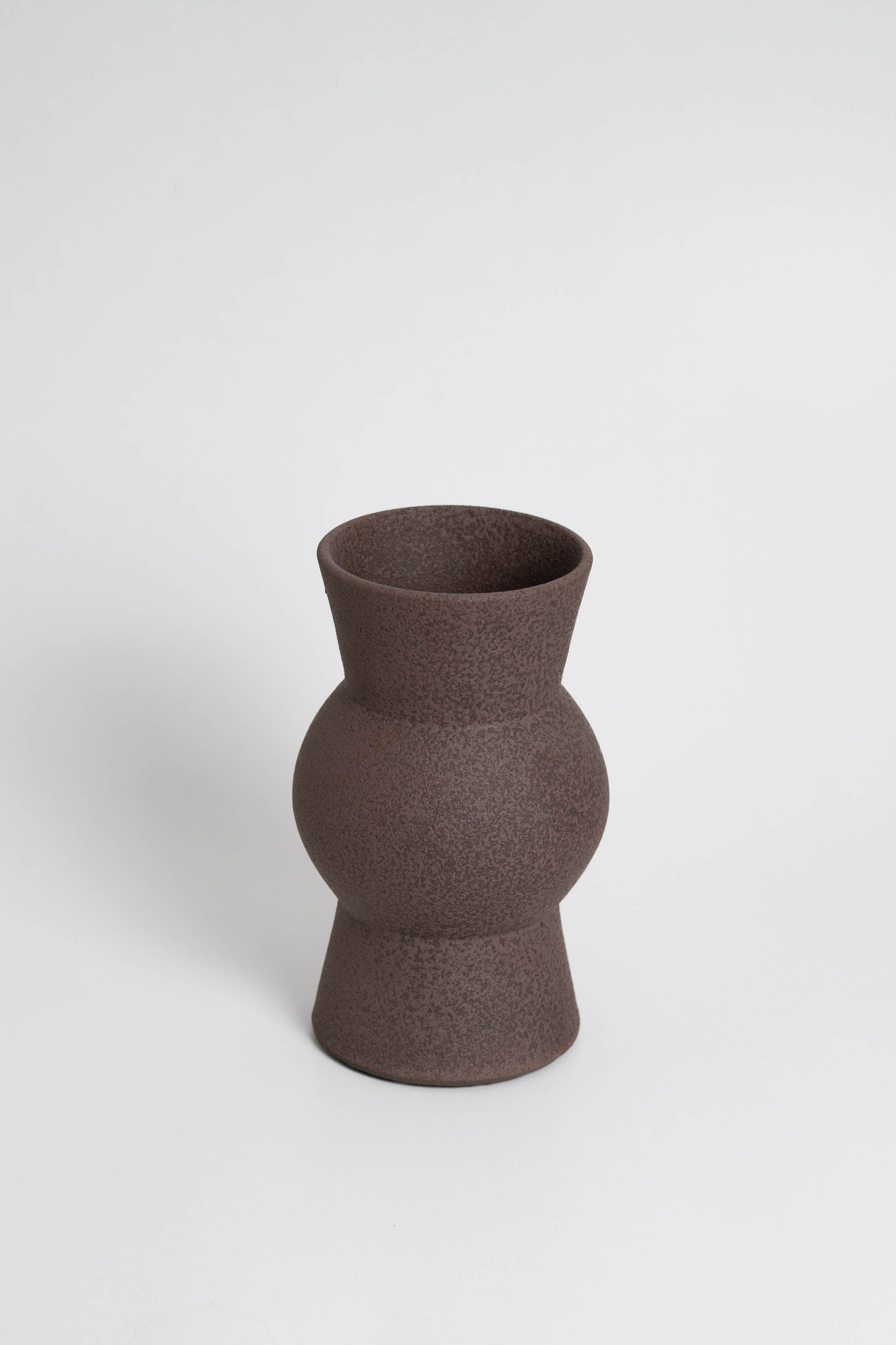 Melas in brown, ceramic vase with a textured, earthy surface, handmade in Portugal. Perfect for displaying flowers or as a unique decorative vase in modern interiors.