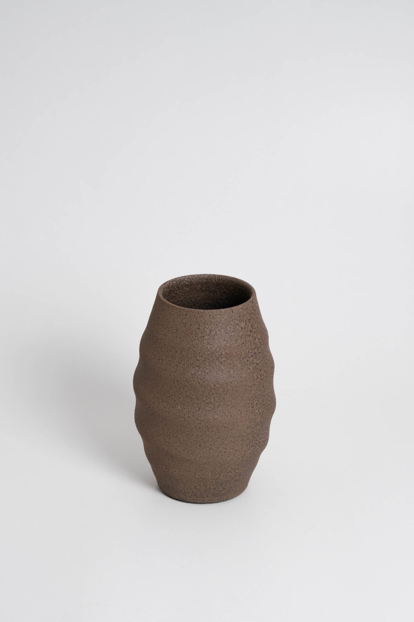 Aonia in brown, decorative vase, minimalist design inspired by the beauty of volcanic textures. It's durable, sustainable and handmade in Portugal.