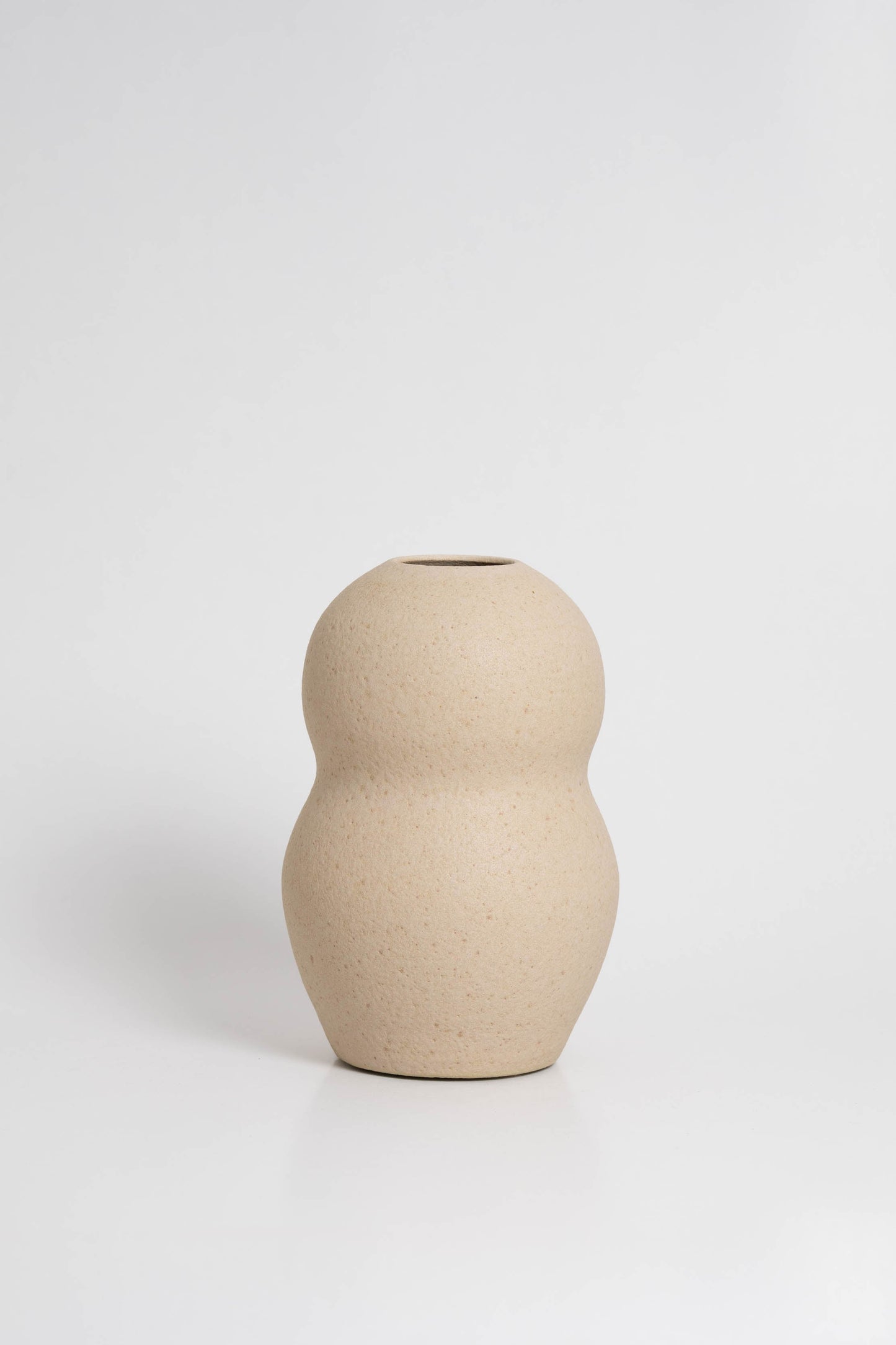 Palus in cream, ceramic vase with a textured, earthy surface, handmade in Portugal. Perfect for displaying flowers or as a unique decorative vase in modern interiors.