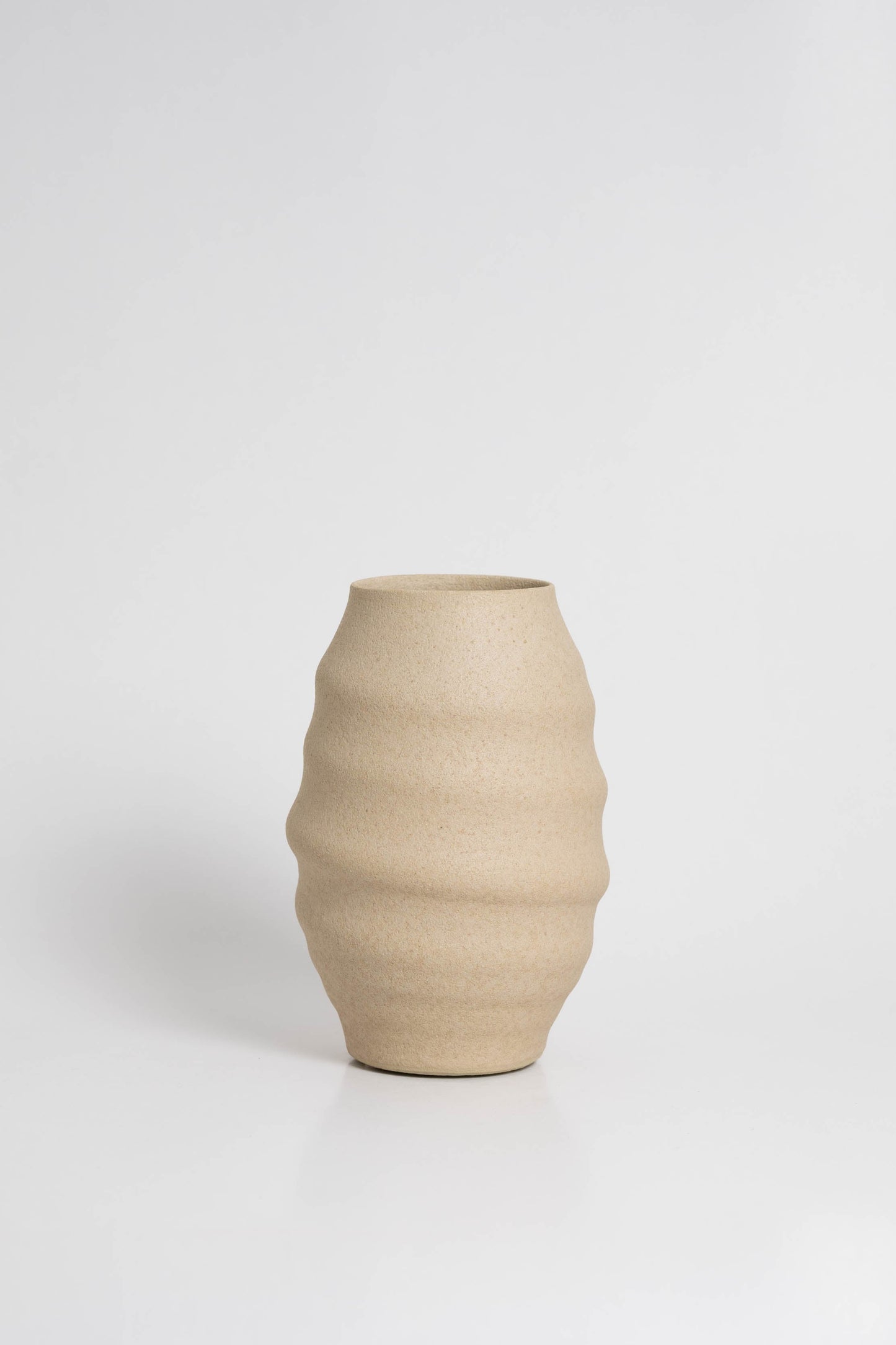 Aonia in cream, decorative vase, minimalist design inspired by the beauty of volcanic textures. It's durable, sustainable and handmade in Portugal.