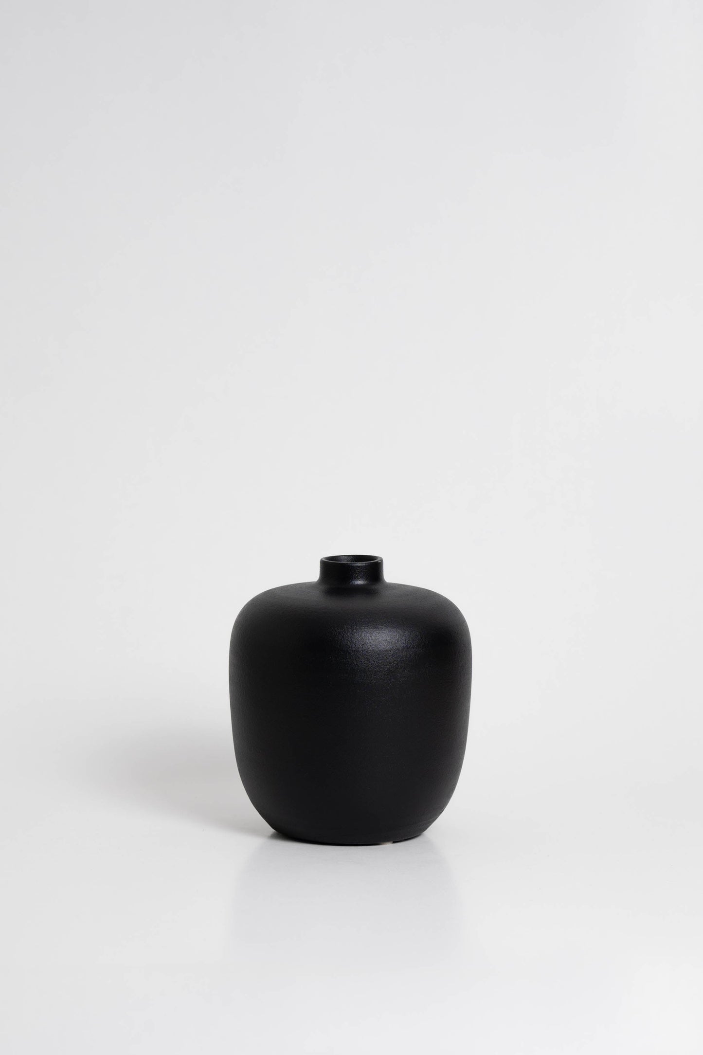 Black 05 Vase in black, ceramic with a minimalist design, handmade in Portugal. Ideal for displaying flowers or as a standalone decorative vase.