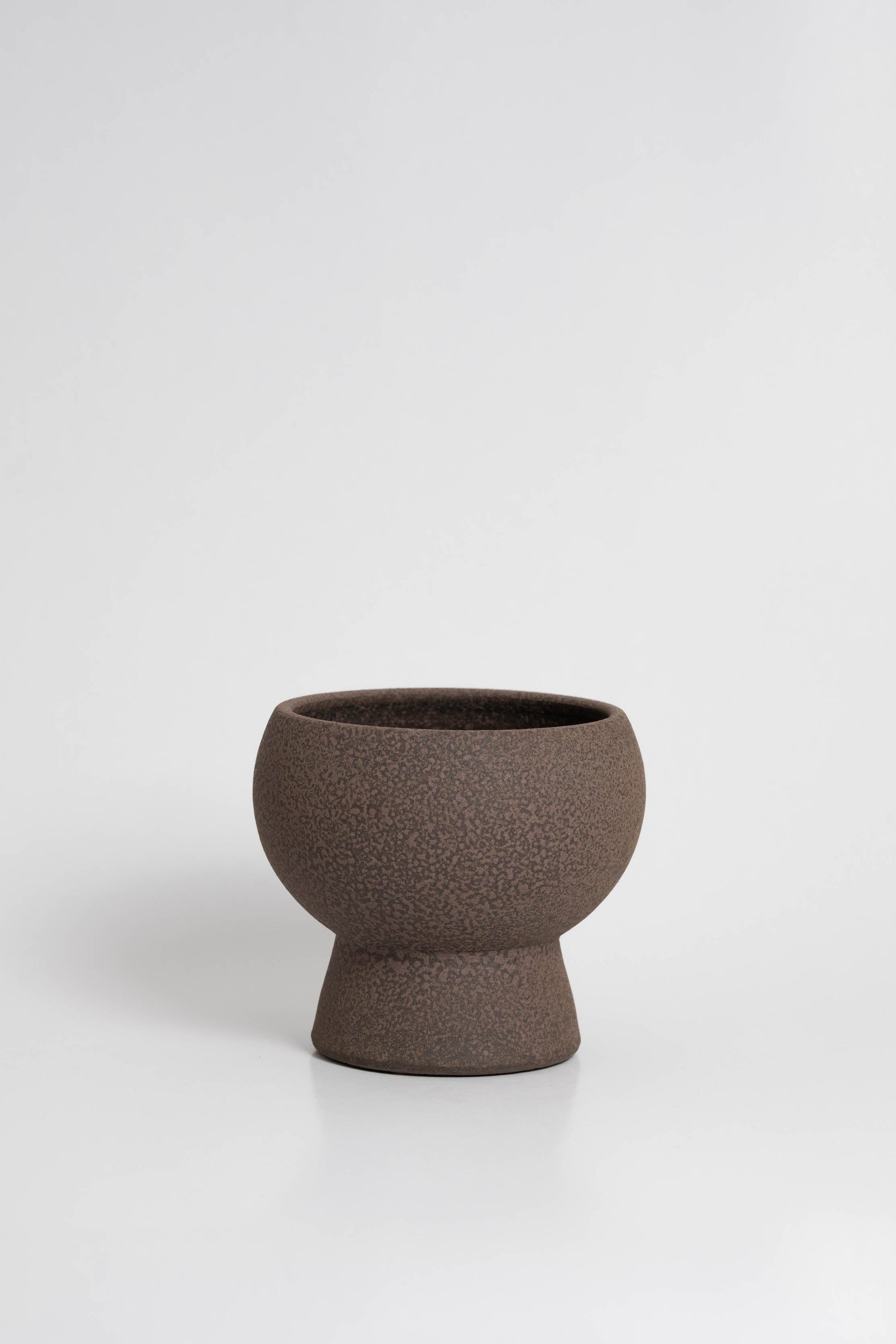 Holden in brown, ceramic vase with a textured, earthy surface, handmade in Portugal. Perfect for displaying flowers or as a unique decorative vase in modern interiors.