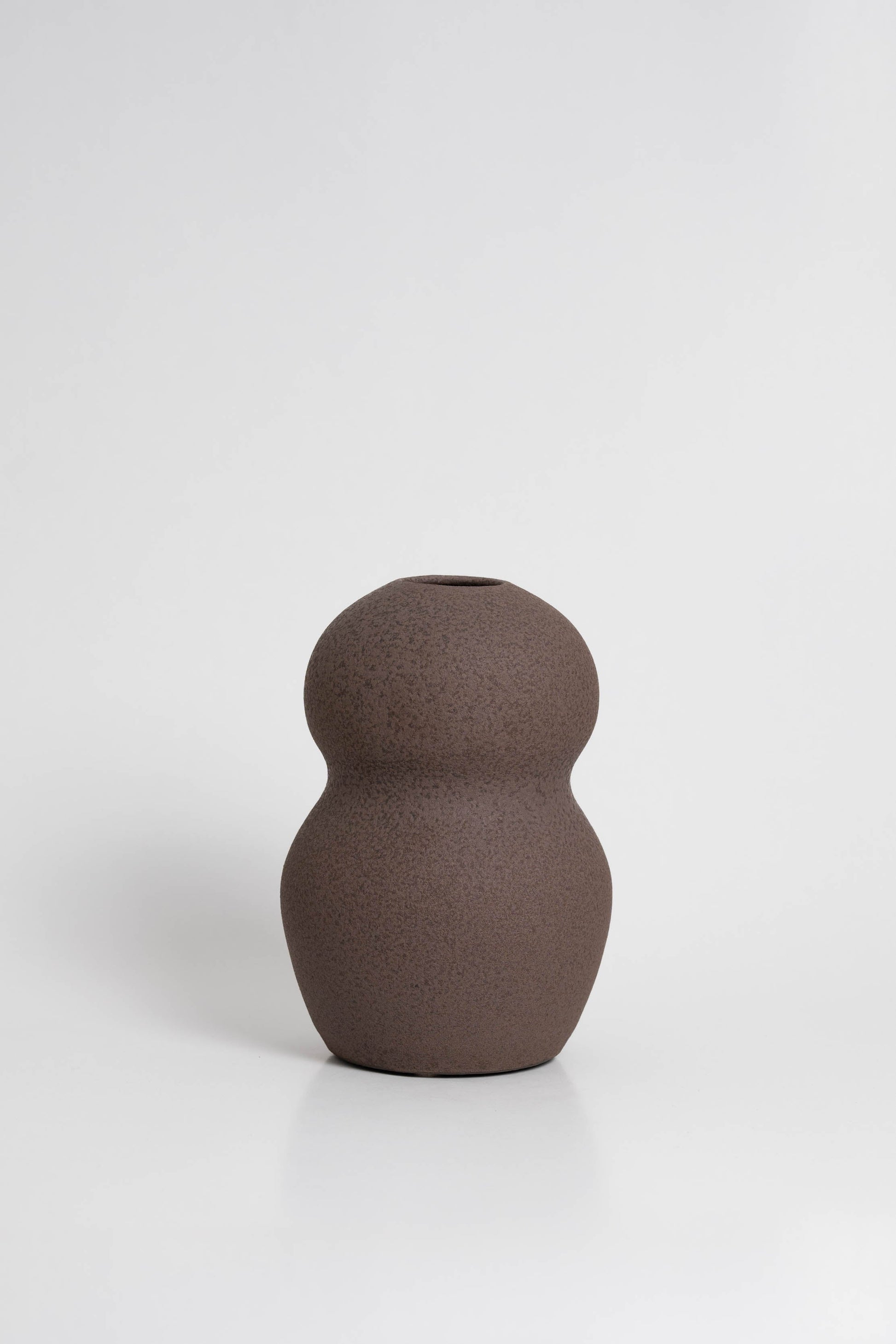 Palus in brown, ceramic vase with a textured, earthy surface, handmade in Portugal. Perfect for displaying flowers or as a unique decorative vase in modern interiors.