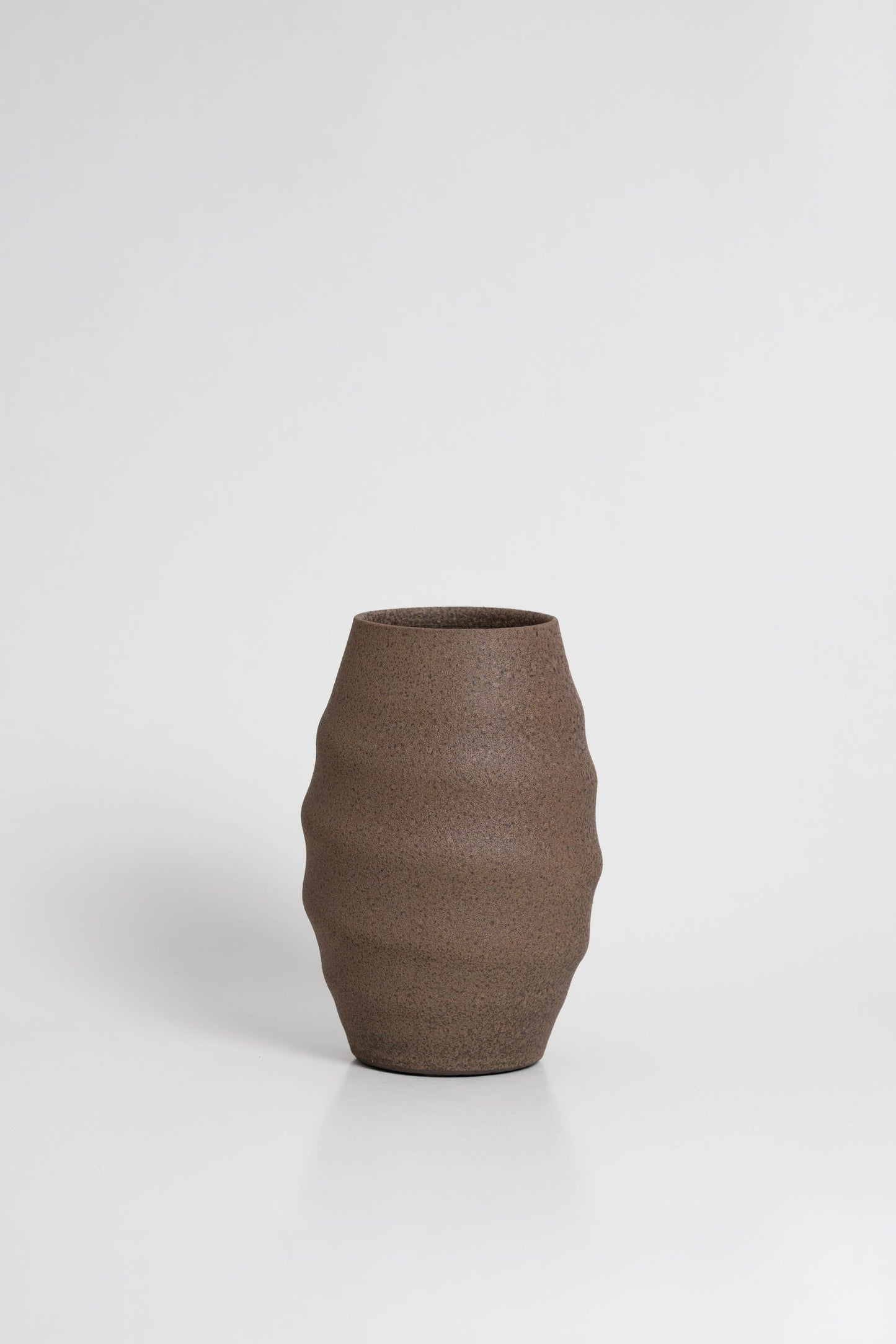 Aonia in brown, decorative vase, minimalist design inspired by the beauty of volcanic textures. It's durable, sustainable and handmade in Portugal.