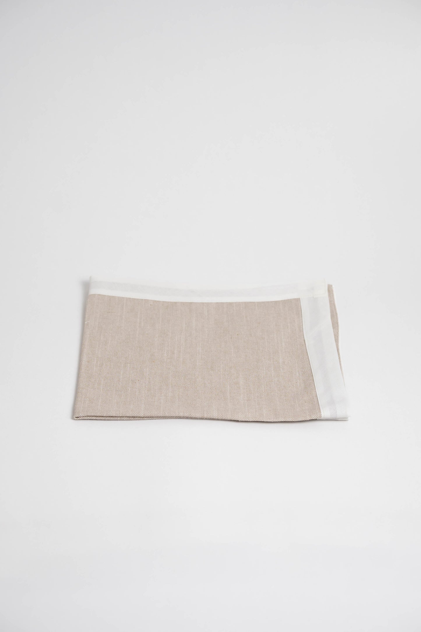 Soft and eco-friendly napkin made from cotton, made in Portugal. Features white border detail. Perfect for table decor.