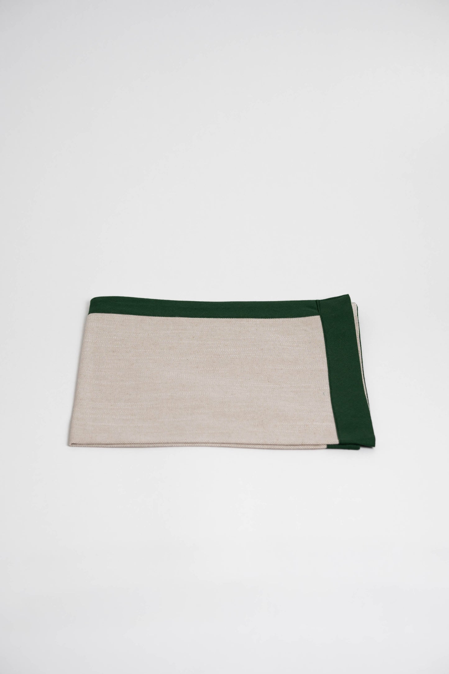 Soft and eco-friendly napkin made from cotton, made in Portugal. Features green border detail. Perfect for table decor.