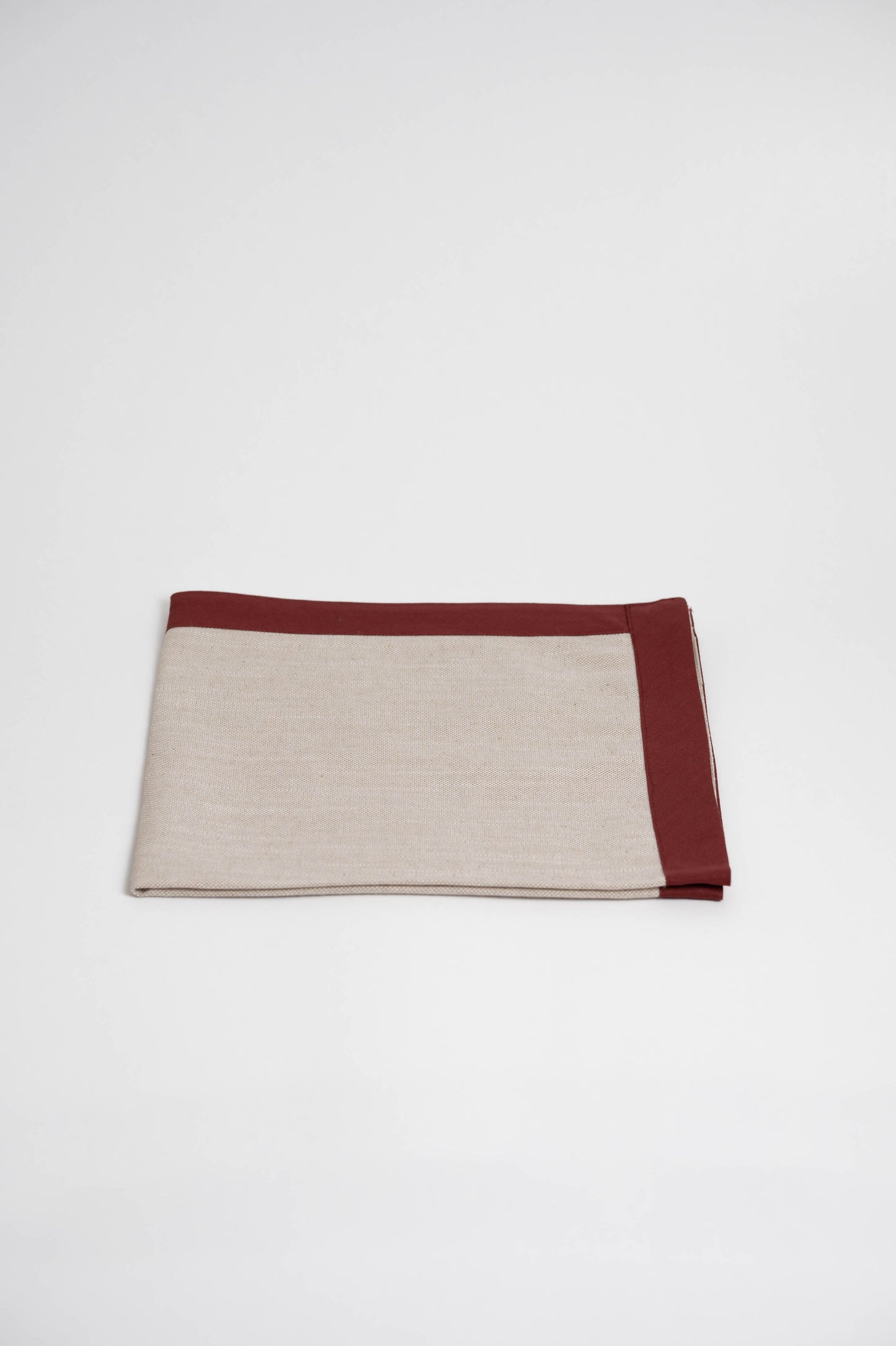 Soft and eco-friendly napkin made from cotton, made in Portugal. Features terracotta border detail. Perfect for table decor.