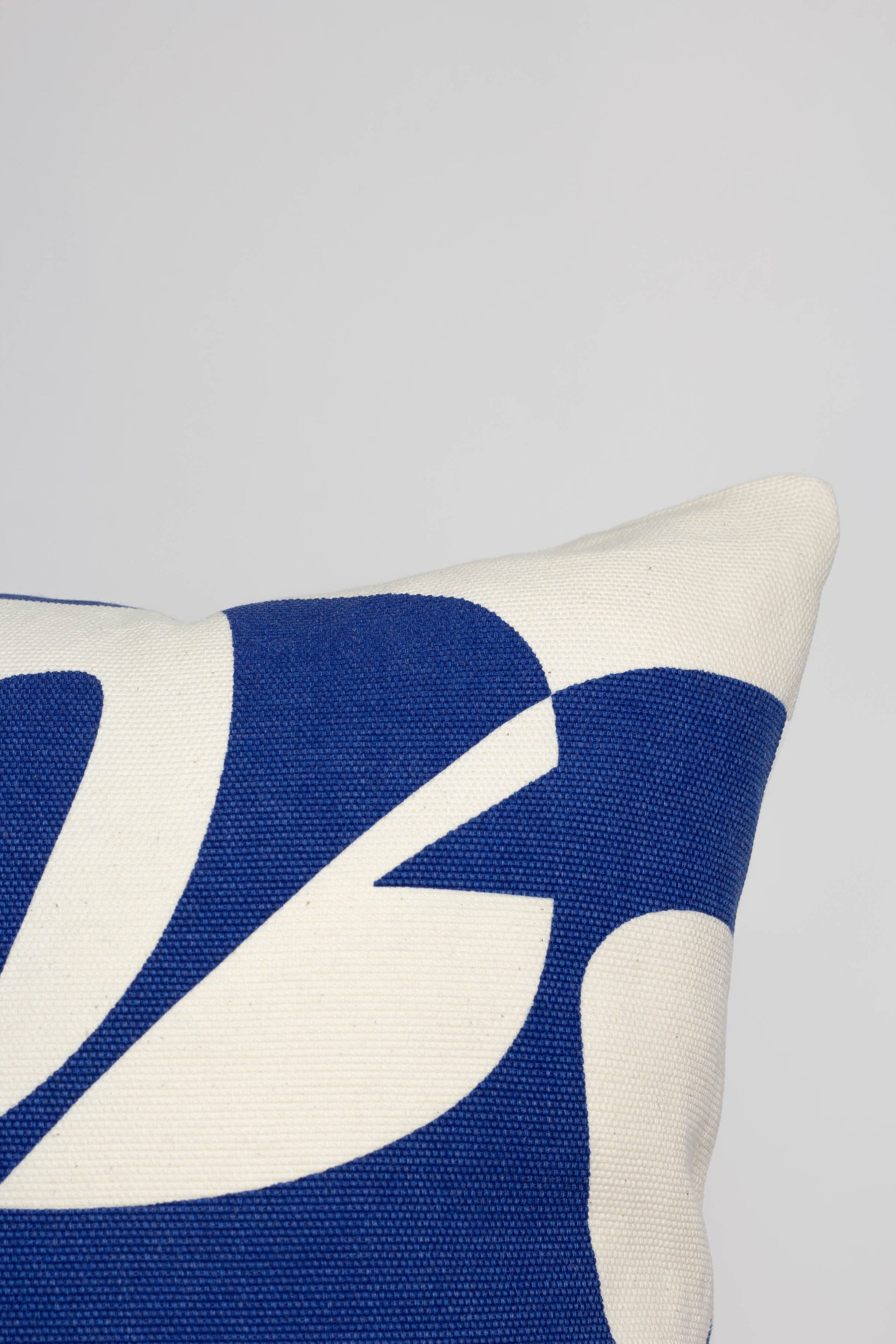 Cotton cushion cover with a vibrant blue print, adding a stylish and colorful touch to any sofa or bed. Made in Portugal