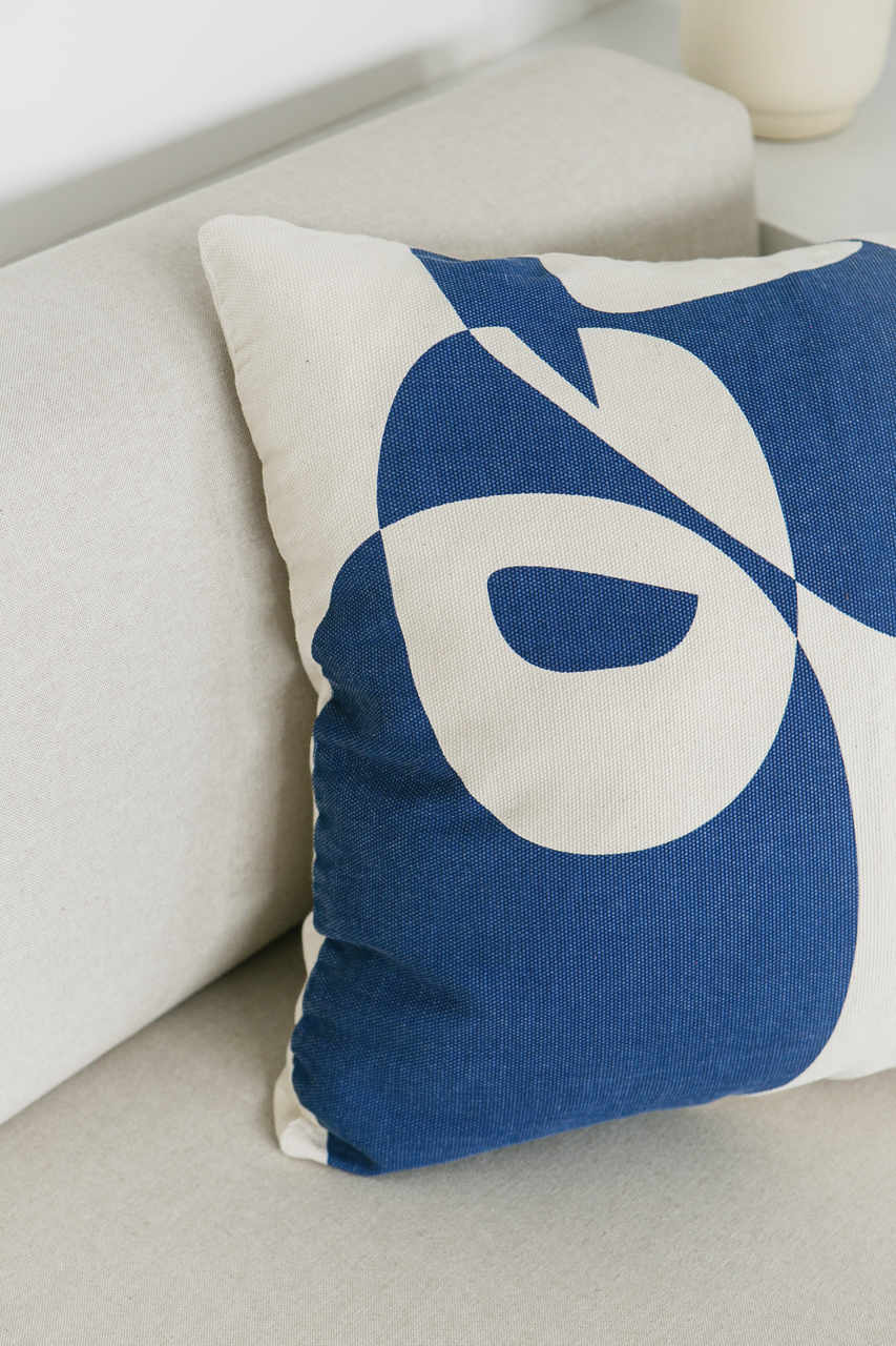 Cotton cushion cover with a vibrant blue print, adding a stylish and colorful touch to any sofa or bed. Made in Portugal