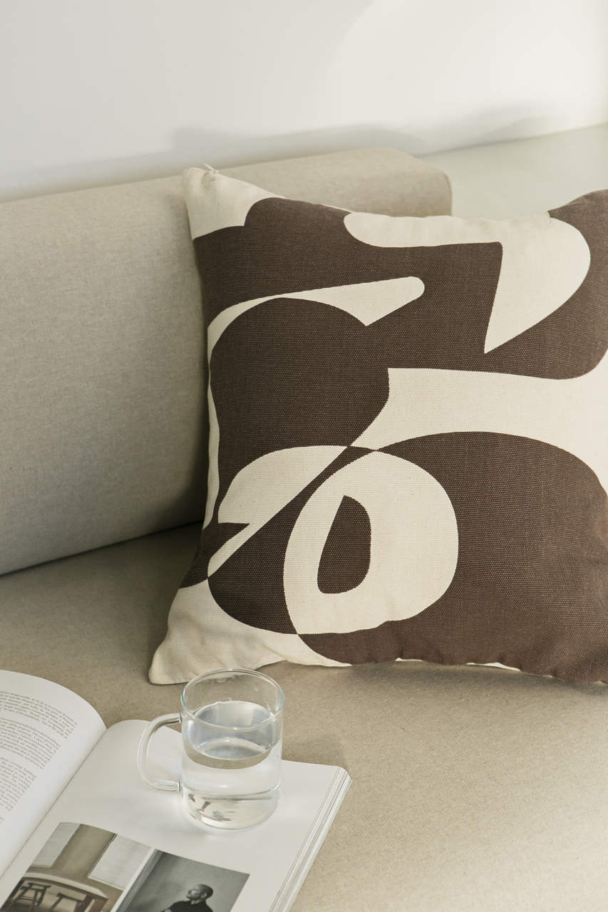 Cotton cushion cover with a vibrant brown print, adding a stylish and colorful touch to any sofa or bed. Made in Portugal