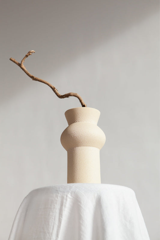 Noachis in cream, ceramic vase with a textured, earthy surface, handmade in Portugal. Perfect for displaying flowers or as a unique decorative vase in modern interiors.