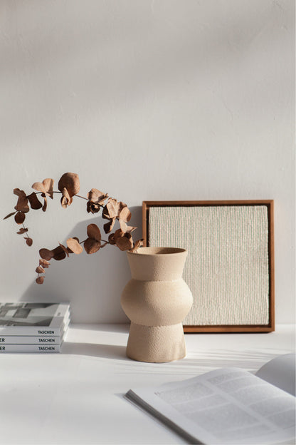 Melas in cream, ceramic vase with a textured, earthy surface, handmade in Portugal. Perfect for displaying flowers or as a unique decorative vase in modern interiors.