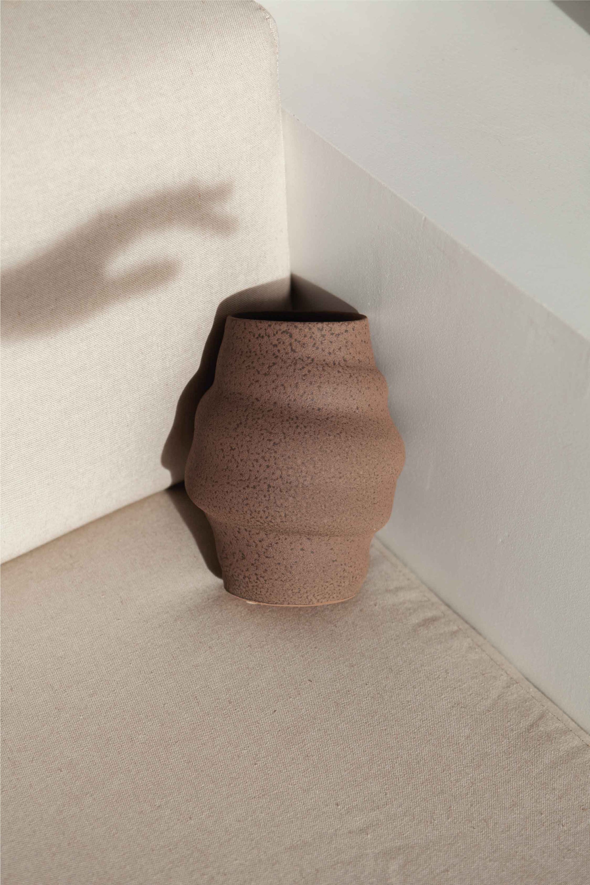 Aonia in brown, decorative vase, minimalist design inspired by the beauty of volcanic textures. It's durable, sustainable and handmade in Portugal.