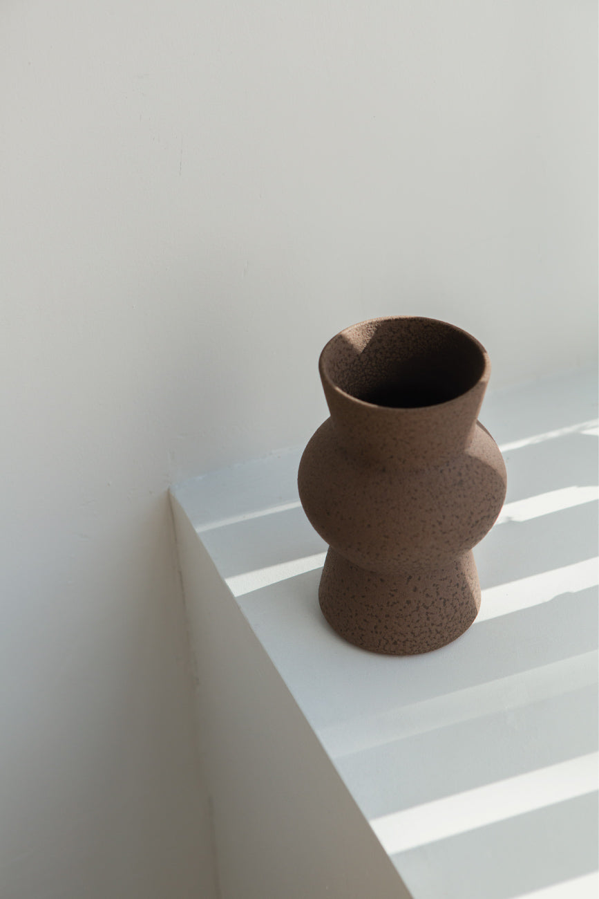 Melas in brown, ceramic vase with a textured, earthy surface, handmade in Portugal. Perfect for displaying flowers or as a unique decorative vase in modern interiors.