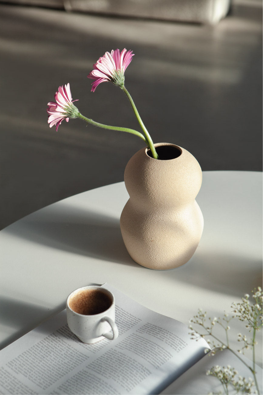 Palus in cream, ceramic vase with a textured, earthy surface, handmade in Portugal. Perfect for displaying flowers or as a unique decorative vase in modern interiors.